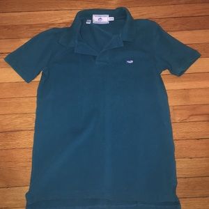 Turquoise polo shirt. Size:medium/ 10-12